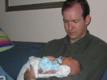 Steve holds baby Charlie